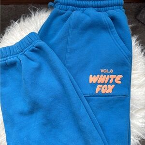 White Fox Boutique Blue Joggers with Orange Logo